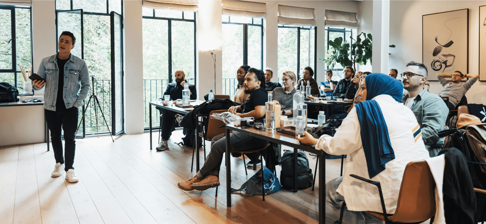 A group of founders watching a presentation in a business incubator program.